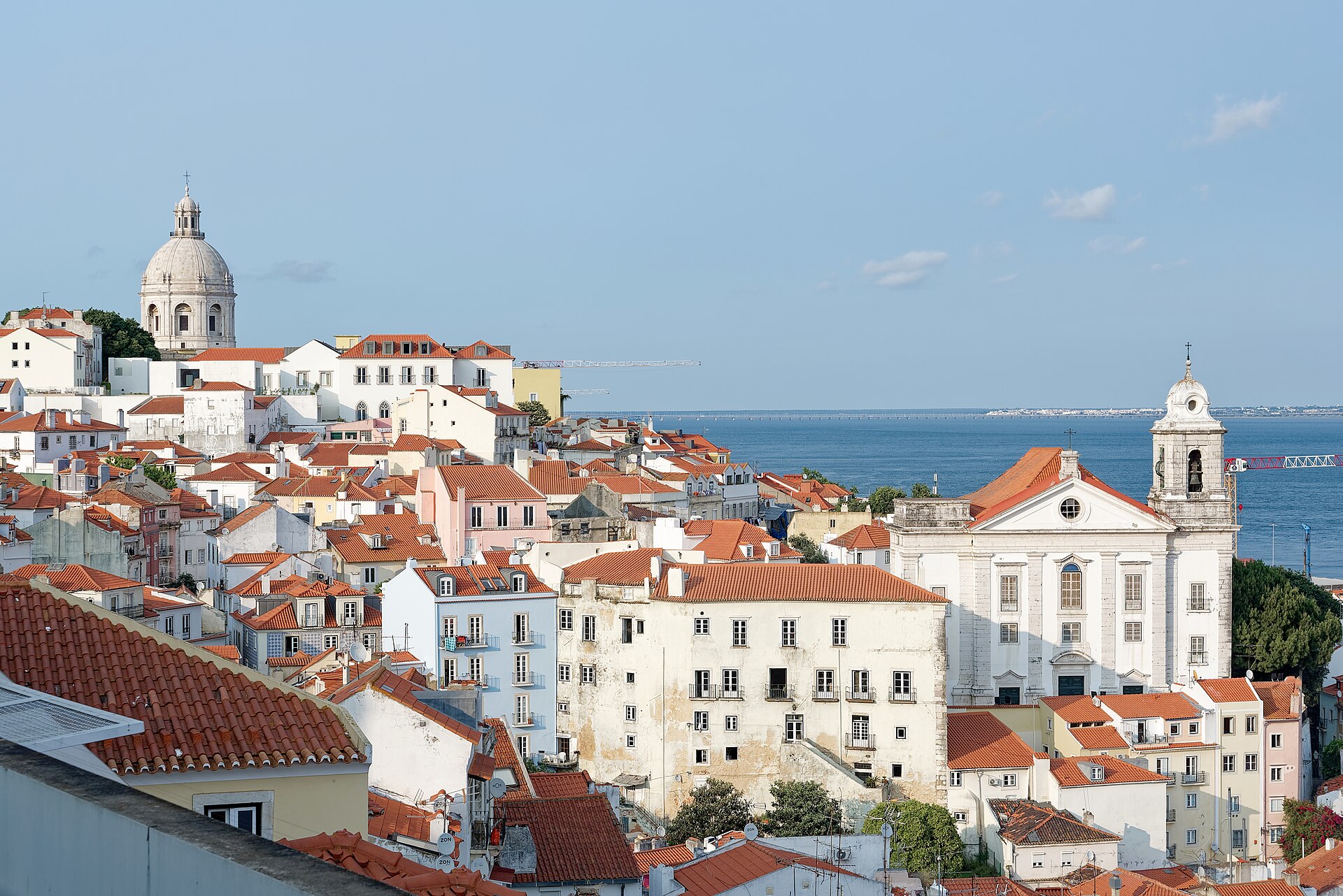 Terracotta rooftops of Alfama and the Tagus river, Lisbon